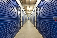 Warehouse with roller doors and private storage sheds