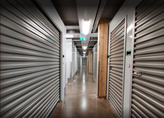 Hallway with grey storage units using electronic smart locks