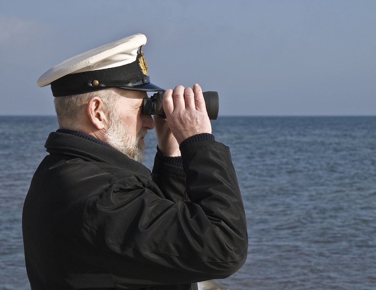 sailor looking in binoculars